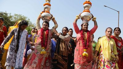 Indian hijras participate in a religious procession in Gandhinagar, India, some 30 kilometers from Ahmedabad, on March 22, 2017. Hijra is a term used in South Asia which refers to transgender individuals who are born male. (gender identity, gender expression)