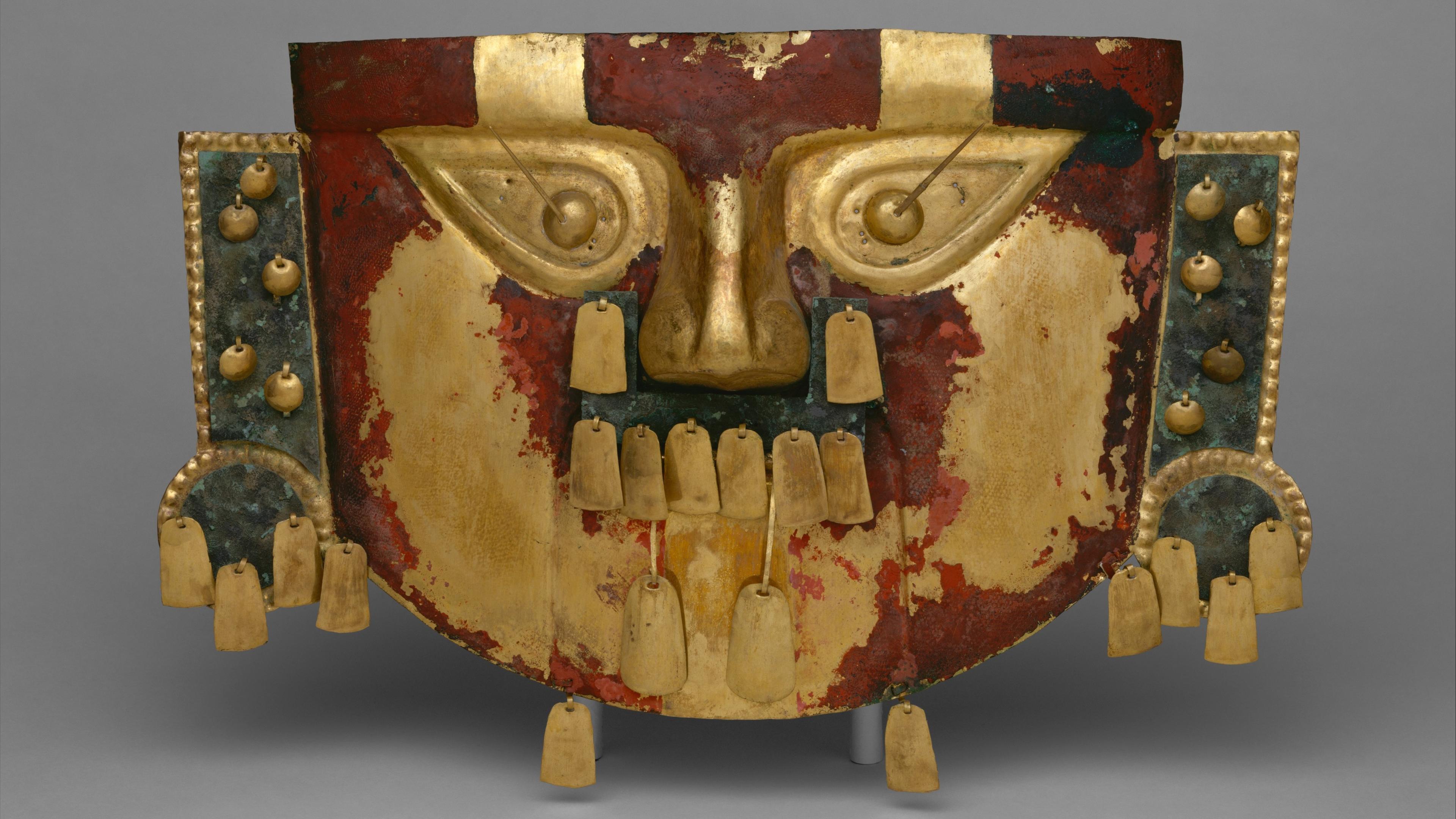 Mask made of hammered sheet gold alloy and covered in red pigment