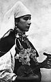 Image 40A Berber musician wearing two large triangular brooches in southern Morocco (early 20th century photo) (from Culture of Morocco)