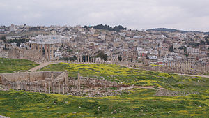 The Roman city of Gerasa and the modern Jerash (in the background).