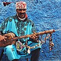 Image 50A Gnawa street performer wearing traditional Gnawi clothing in Rabat's Qasbat al-Widaya (from Culture of Morocco)